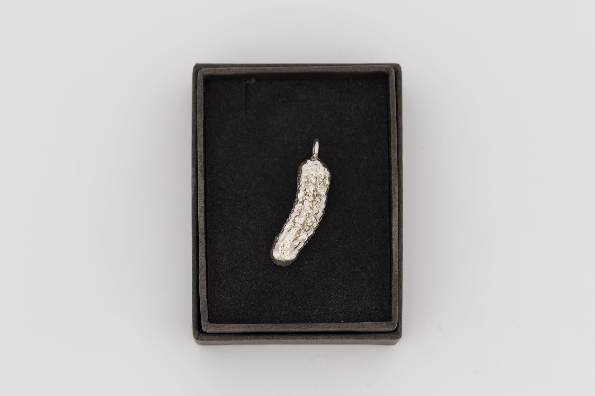 'Cornichons' solid silver pickle pendants by Caitlin Hazell 
